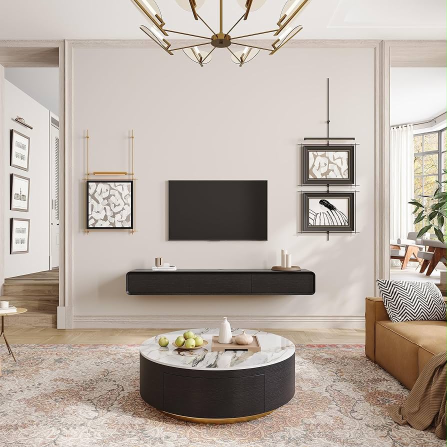 Flat screen TV mounted above a wooden console in a styled living room